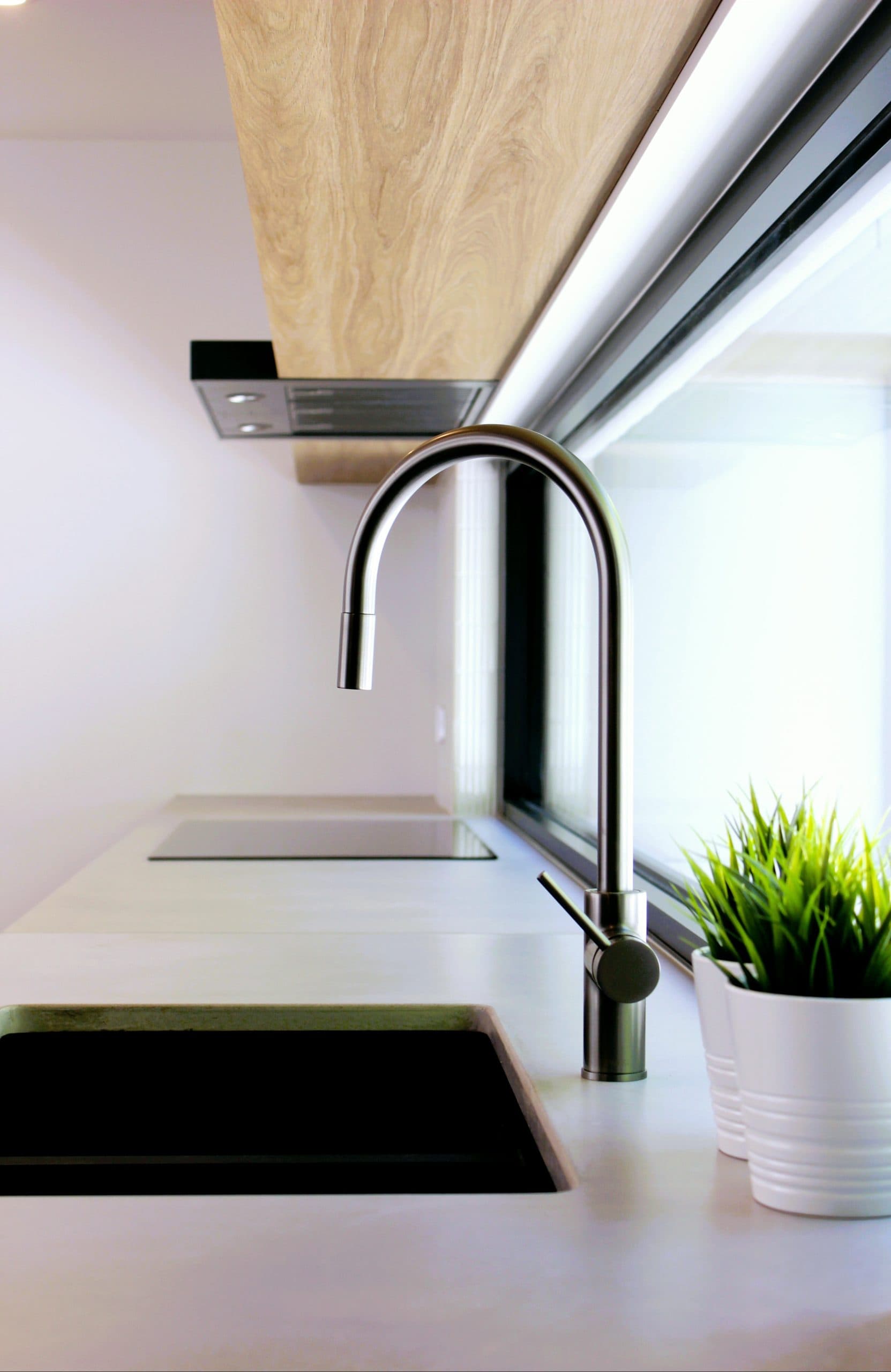 Modern kitchen renovation in Canberra with sleek design and natural finishes.